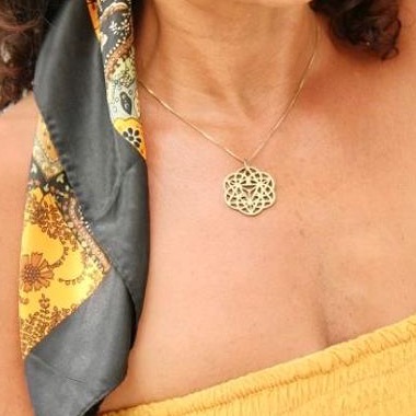 The Activator Key — sacred geometry pendant worn