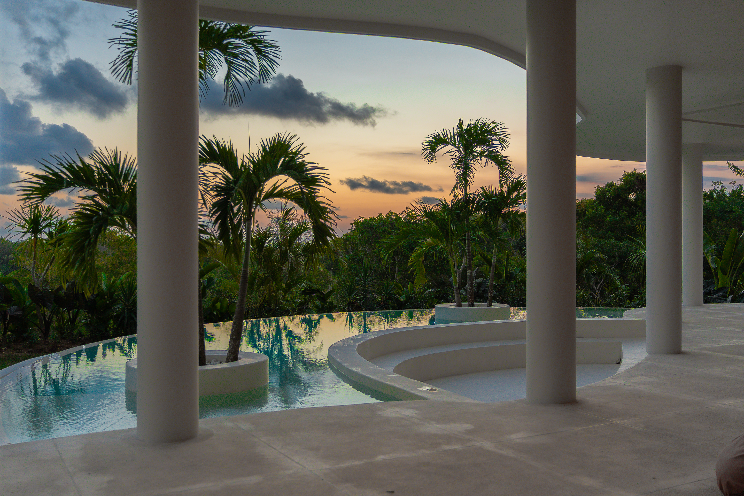 SOL pool and columns at sunset